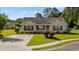 Charming single-story home with manicured lawn, inviting curb appeal, and neutral-colored siding at 1505 Bramber Pl., Conway, SC 29527