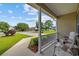 Relaxing front porch featuring comfortable seating and views of the landscaped yard at 1505 Bramber Pl., Conway, SC 29527