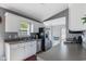 This kitchen features white cabinets, stainless steel appliances, and a window over the sink for natural lighting at 1505 Bramber Pl., Conway, SC 29527