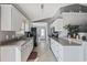 A long kitchen design with white cabinets and ample counter space, offering lots of storage and food preparation space at 1505 Bramber Pl., Conway, SC 29527