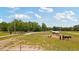 Large acreage with horse paddocks and stables, offering ample space for equestrian activities at 151 Saddle Dr., Loris, SC 29569