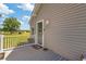 Back porch features a wood deck, outdoor lighting and a storm door at 151 Saddle Dr., Loris, SC 29569