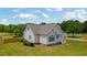 Exterior of home with lush green lawn and fenced in area at 151 Saddle Dr., Loris, SC 29569