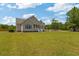 Charming single-story home with a well-manicured lawn and a welcoming front porch at 151 Saddle Dr., Loris, SC 29569