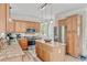 Spacious kitchen featuring granite countertops, a kitchen island, stainless steel appliances, and light wood cabinets at 151 Saddle Dr., Loris, SC 29569