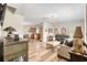 Spacious living area with hardwood floors, neutral walls, plush sofas, and an open layout with a view into the kitchen at 151 Saddle Dr., Loris, SC 29569