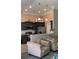 Open-concept living area with gray cabinets, stainless appliances, neutral seating, and granite countertops at 151 Saddle Dr., Loris, SC 29569