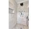 Modern shower featuring neutral tile with decorative inset at 151 Saddle Dr., Loris, SC 29569