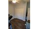 Simple bedroom with hardwood floors, closet, neutral color palette, and ample natural light at 1717 Perdiz Covey Ct., Myrtle Beach, SC 29588