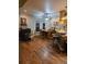 Traditional dining room area with wood floors, natural lighting, and adjacent kitchen at 1717 Perdiz Covey Ct., Myrtle Beach, SC 29588