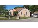 Lovely single story brick home with a meticulously manicured front lawn and mature trees at 1717 Perdiz Covey Ct., Myrtle Beach, SC 29588