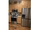 Kitchen featuring stainless steel appliances, including a refrigerator, oven, and microwave and wood floors at 1717 Perdiz Covey Ct., Myrtle Beach, SC 29588