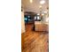 Open concept kitchen flows seamlessly into the living and dining areas with gleaming wood flooring at 1717 Perdiz Covey Ct., Myrtle Beach, SC 29588