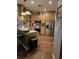 Modern kitchen featuring stainless steel appliances, wooden cabinets, hardwood floors, and counter seating at 1717 Perdiz Covey Ct., Myrtle Beach, SC 29588