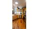 Gourmet kitchen featuring wooden cabinetry, stainless steel appliances, and wood floors at 1717 Perdiz Covey Ct., Myrtle Beach, SC 29588