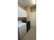 Functional laundry room with washer, dryer, storage cabinets, and tile flooring at 1717 Perdiz Covey Ct., Myrtle Beach, SC 29588