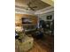 Comfortable living room with wood panel wall, ceiling fan, hardwood floors, and neutral color palette at 1717 Perdiz Covey Ct., Myrtle Beach, SC 29588