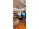 Inviting living room with hardwood floors, wood paneling, a large TV, and a comfortable sofa at 1717 Perdiz Covey Ct., Myrtle Beach, SC 29588