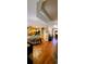 Open-concept kitchen and entryway featuring hardwood floors, modern lighting, and ample natural light at 1717 Perdiz Covey Ct., Myrtle Beach, SC 29588