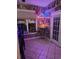 Cozy patio area with neon bar signs, bar stools, and nearby window at 1717 Perdiz Covey Ct., Myrtle Beach, SC 29588