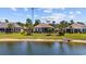 Peaceful backyard with a waterfront view of the lake, complemented by mature trees at 179 Hyacinth Loop, Murrells Inlet, SC 29576
