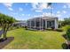 Well-maintained backyard with lush greenery and a screened porch for outdoor enjoyment at 179 Hyacinth Loop, Murrells Inlet, SC 29576