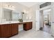 Bathroom featuring double sinks and vanity, and large mirror at 179 Hyacinth Loop, Murrells Inlet, SC 29576