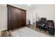 Bedroom with built-in wardrobe and an adjacent home office space featuring wood look floors at 179 Hyacinth Loop, Murrells Inlet, SC 29576