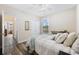 Cozy bedroom with natural light, ceiling fan, and closet at 179 Hyacinth Loop, Murrells Inlet, SC 29576