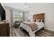 Comfortable bedroom with ceiling fan, window, curtains and a comfortable chair at 179 Hyacinth Loop, Murrells Inlet, SC 29576