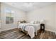 Bright bedroom features a ceiling fan, a window, and natural light at 179 Hyacinth Loop, Murrells Inlet, SC 29576