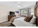 Nicely appointed bedroom featuring a window, ceiling fan, and comfortable chair at 179 Hyacinth Loop, Murrells Inlet, SC 29576