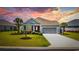Charming home with well-manicured front yard and an attached two-car garage at 179 Hyacinth Loop, Murrells Inlet, SC 29576