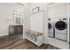 Hallway with coat rack and a laundry room with washer and dryer at 179 Hyacinth Loop, Murrells Inlet, SC 29576
