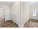 Hallway with a view of the front door, and light-colored walls at 179 Hyacinth Loop, Murrells Inlet, SC 29576