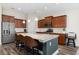 Bright kitchen with granite island, stainless appliances, breakfast bar, and modern finishes at 179 Hyacinth Loop, Murrells Inlet, SC 29576