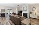 Inviting living room featuring a fireplace, large TV, and sliding glass doors leading to an outdoor patio at 179 Hyacinth Loop, Murrells Inlet, SC 29576
