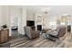 Comfortable living room with a fireplace, TV, and plenty of seating for relaxation at 179 Hyacinth Loop, Murrells Inlet, SC 29576