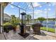 Inviting screened-in patio featuring outdoor seating with a lake view at 179 Hyacinth Loop, Murrells Inlet, SC 29576