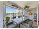 Inviting screened-in patio featuring outdoor seating with lake views at 179 Hyacinth Loop, Murrells Inlet, SC 29576