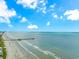 Wide aerial view of a sandy beach with a pier reaching into the ocean at 191 Maison Dr. # B-323, Myrtle Beach, SC 29572