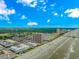 Extensive aerial view of coastline featuring the beach, pier, resorts, and city at 191 Maison Dr. # B-323, Myrtle Beach, SC 29572