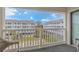 Balcony with seating area overlooking manicured landscape and other residences at 191 Maison Dr. # B-323, Myrtle Beach, SC 29572