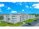 Well-maintained condo building with manicured landscaping and convenient parking at 191 Maison Dr. # B-323, Myrtle Beach, SC 29572
