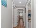 Hallway that leads to the living room on the left and a full bathroom to the right at 191 Maison Dr. # B-323, Myrtle Beach, SC 29572