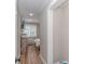 Hallway view of a bedroom with blinds and a view of the room at 191 Maison Dr. # B-323, Myrtle Beach, SC 29572