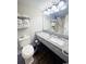 Bright bathroom with a toilet, granite vanity, and towel storage, offering a clean and functional space at 201 N Ocean Blvd. # 2536, Myrtle Beach, SC 29572