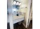 Small sink and vanity in bathroom with a gray granite countertop and a modern faucet at 201 N Ocean Blvd. # 2536, Myrtle Beach, SC 29572