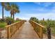 Follow the boardwalk to the sandy beach from this resort surrounded by lush vegetation and palm trees at 201 N Ocean Blvd. # 2536, Myrtle Beach, SC 29572