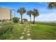 A stone path leads to the beach from the lawn of this ocean front resort with a view of the water at 201 N Ocean Blvd. # 2536, Myrtle Beach, SC 29572